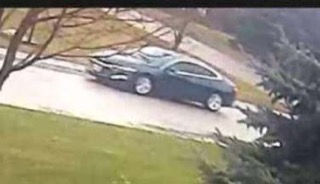 Black car on a wet road