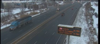 Train on tracks, snowy ground. Guelph, Lincoln Alexander Parkway-Hamilton 38 mins.