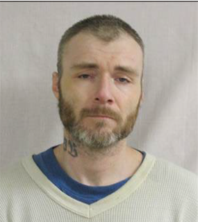 Man with closely-cropped hair and a beard