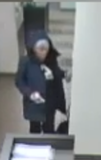 Person in a dark coat and hat