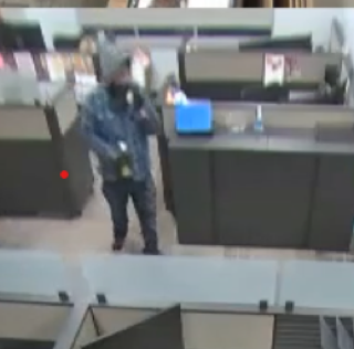 Person wearing a plaid shirt and black pants