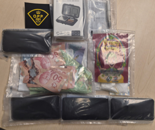 Canadian fifty-dollar bills, digital scale, resealable plastic bags