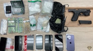 Pile of cash, drugs, and cell phones.