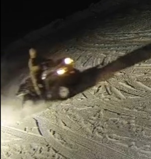 Snowmobile tracks in snow.