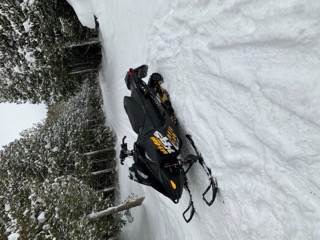 Snowmobile on a snowy hillside