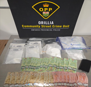 Canadian currency and baggies on a table.