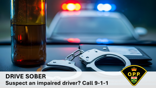 Drive Sober. Suspect an impaired driver? Call 9-1-1. O.P.P. crest. Handcuffs and a bottle of liquor in front of police lights.
