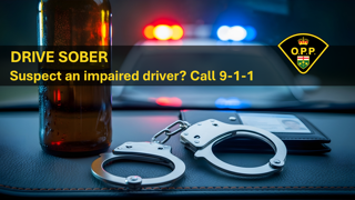 Drive sober. Suspect an impaired driver? Call 9-1-1. Handcuffs and a bottle of alcohol.
