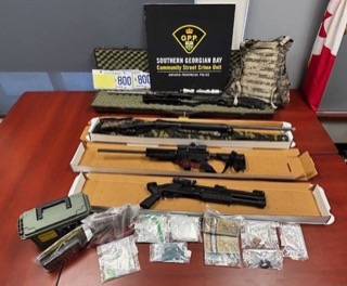 Firearms and cash seized by police.