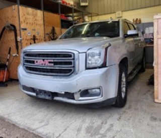 Silver GMC Yukon SUV