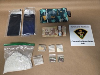 Canadian currency and small plastic bags. Norfolk and Haldimand OPP Community Street Crime Unit.