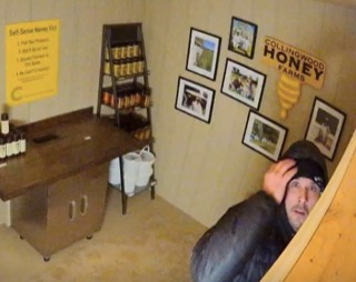 Man partially visible, looking at the camera